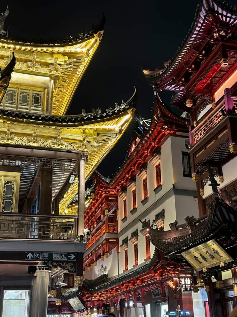 Night view of Yuyuan Old Street's vibrant traditional architecture in Shanghai.