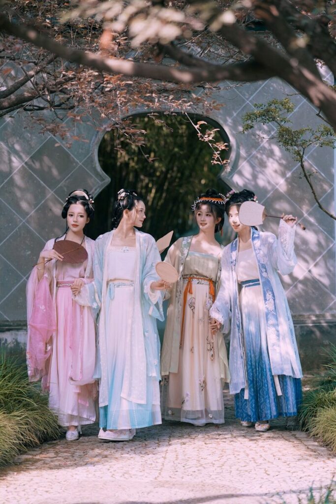 a group of women in dresses